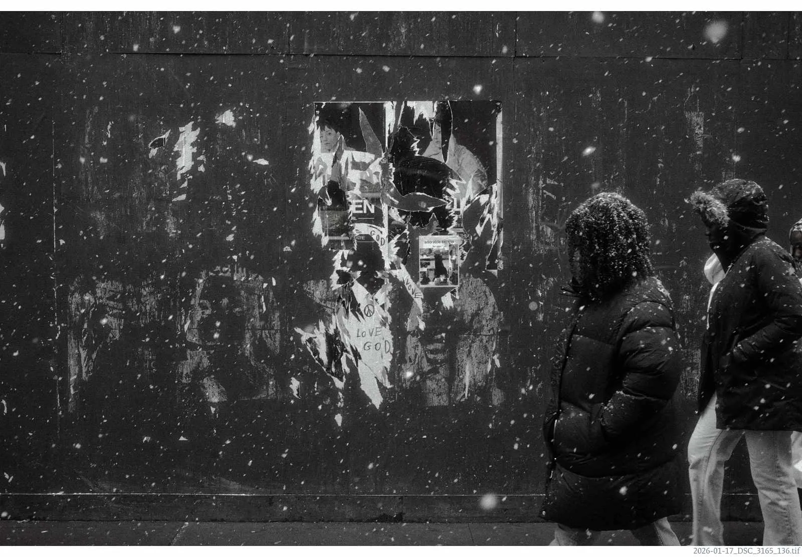 Photo of people walking in the snow with an annotation on the bottom right below the image that says 2026-01-17_DSC_3165_136.tif