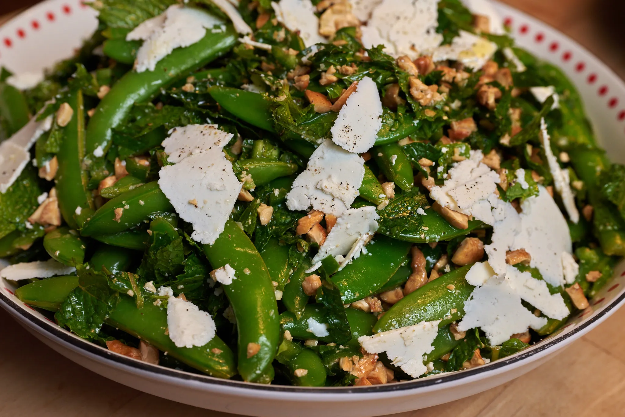 Sugar snap peas with calabrian chile, mint, and ricotta salata