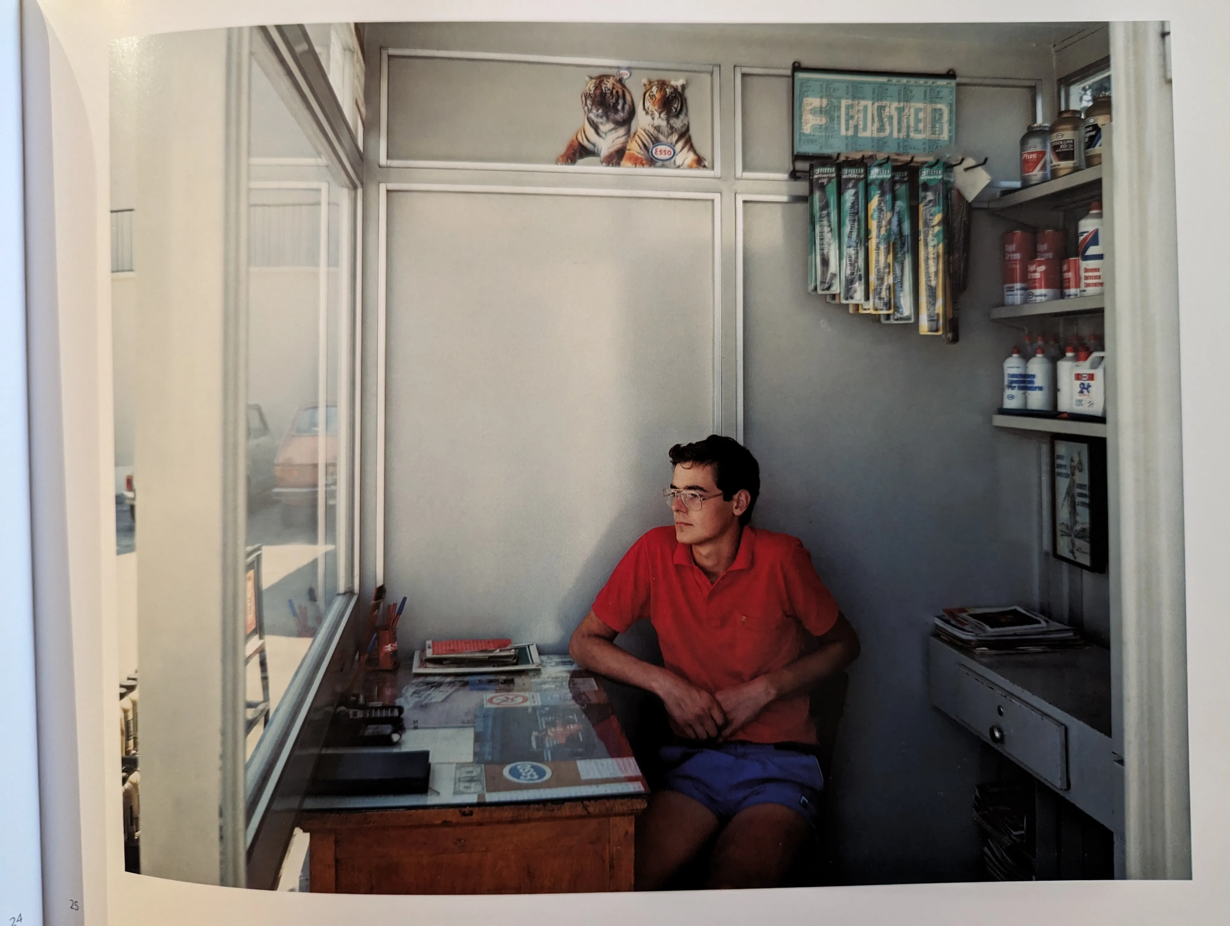 Guido Guidi's photo of a young person working in a little shack